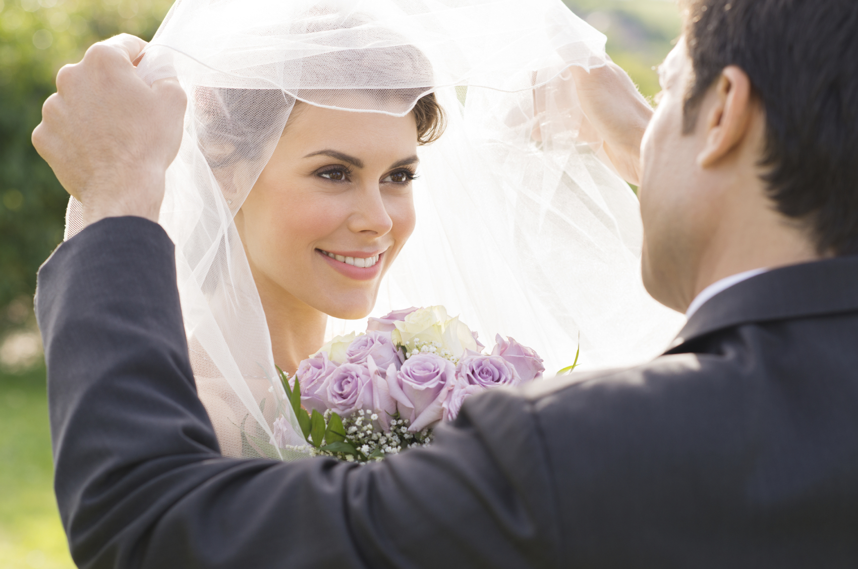 Groom Looking At Bride With Love.